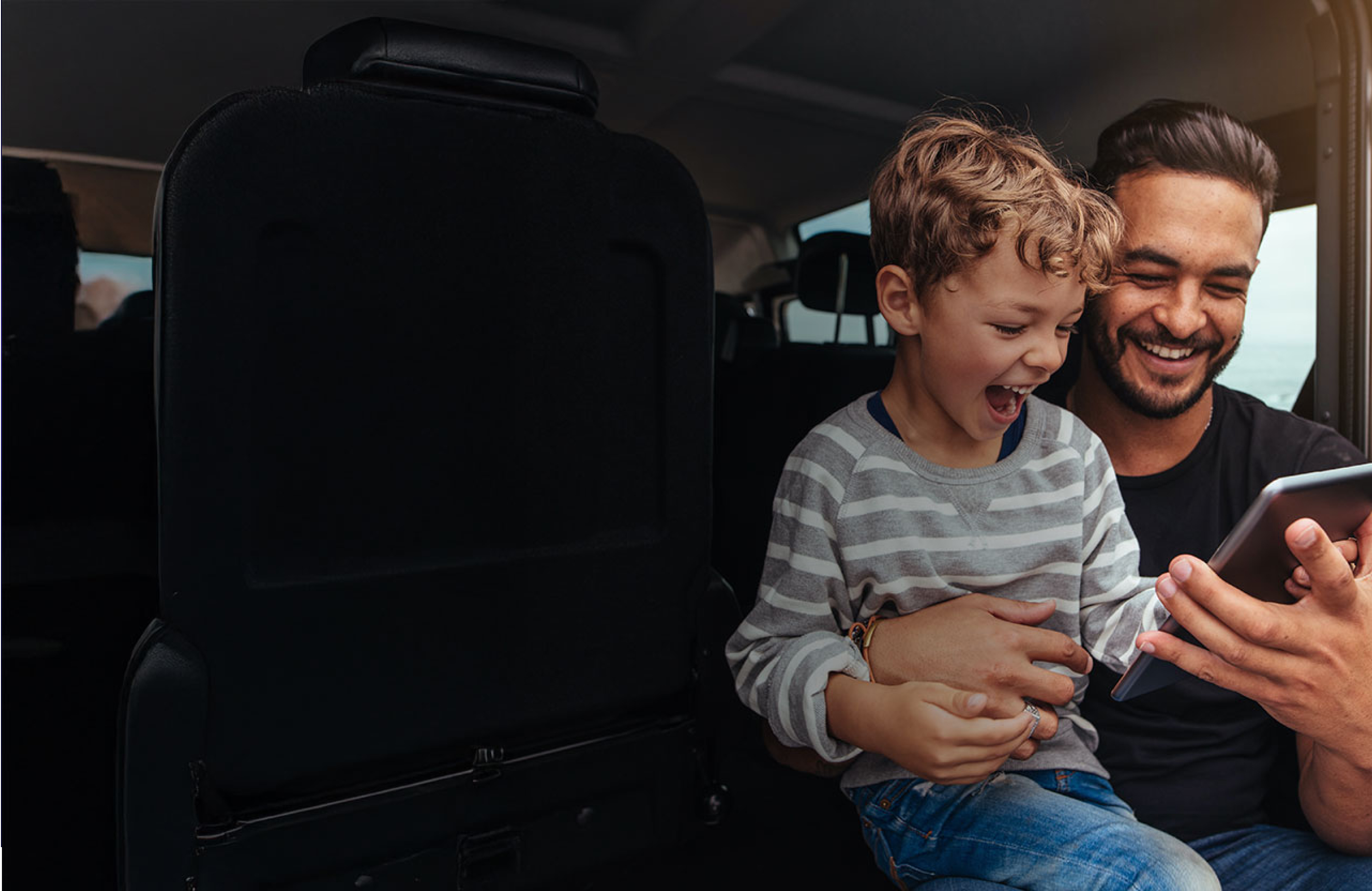 Digital experience agency employees collaborating on computer at desk.